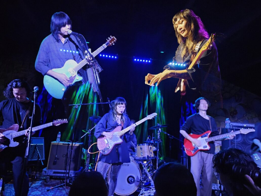 Yvette Young Of Covet (Center) Performs With Lite, With Superimposed Images Of Wylie Hopkins (Top Left) And Young (Top Right).