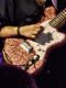 Close Up Of Yvette Young'S Tattooed Hand And Sparkly Pink Guitar